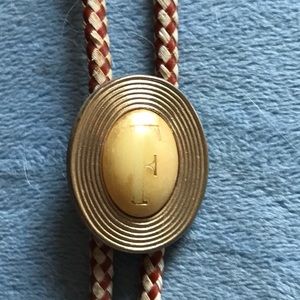 Vintage monogrammed F bolo tie. Made by Swank.